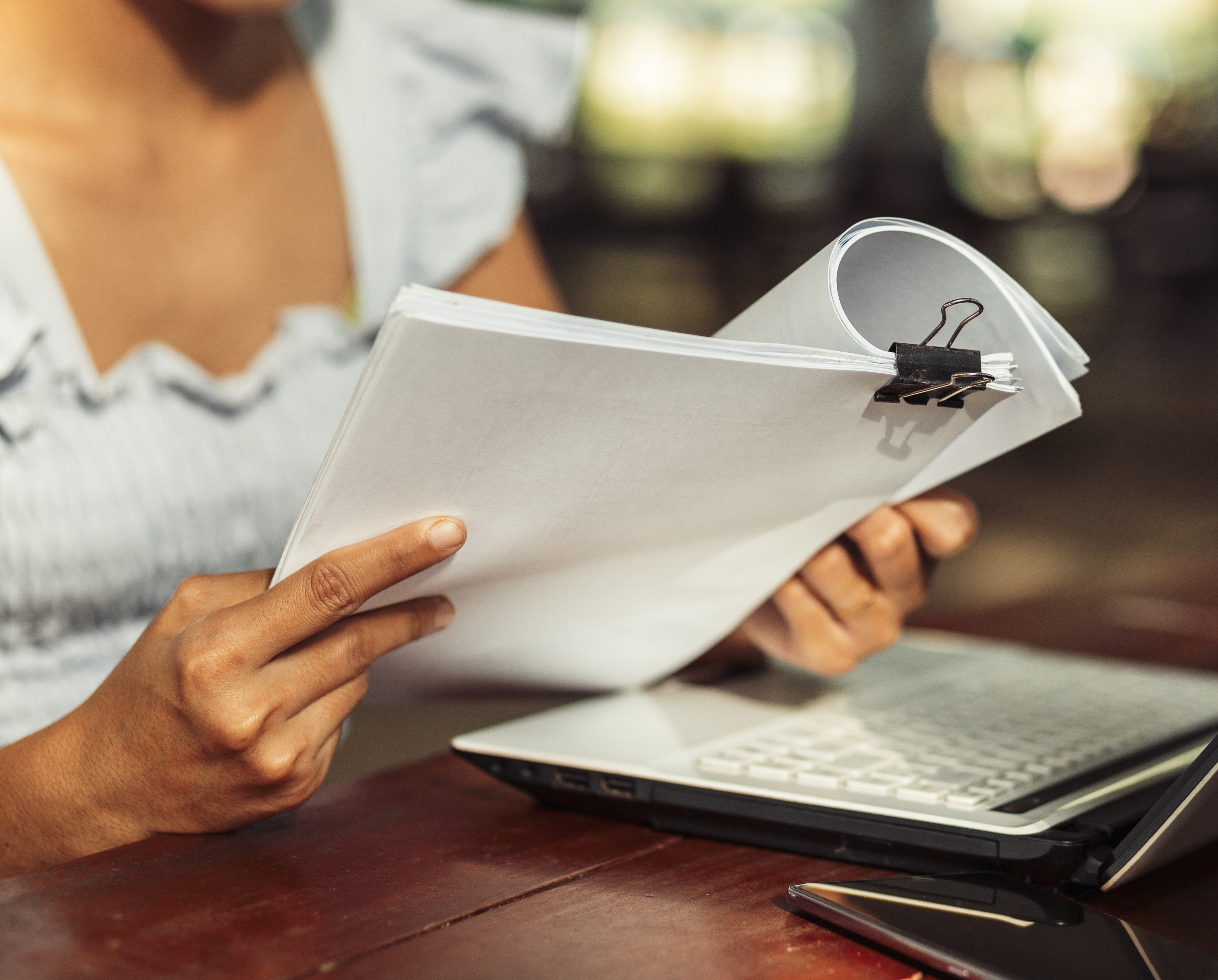 female holding paperwork